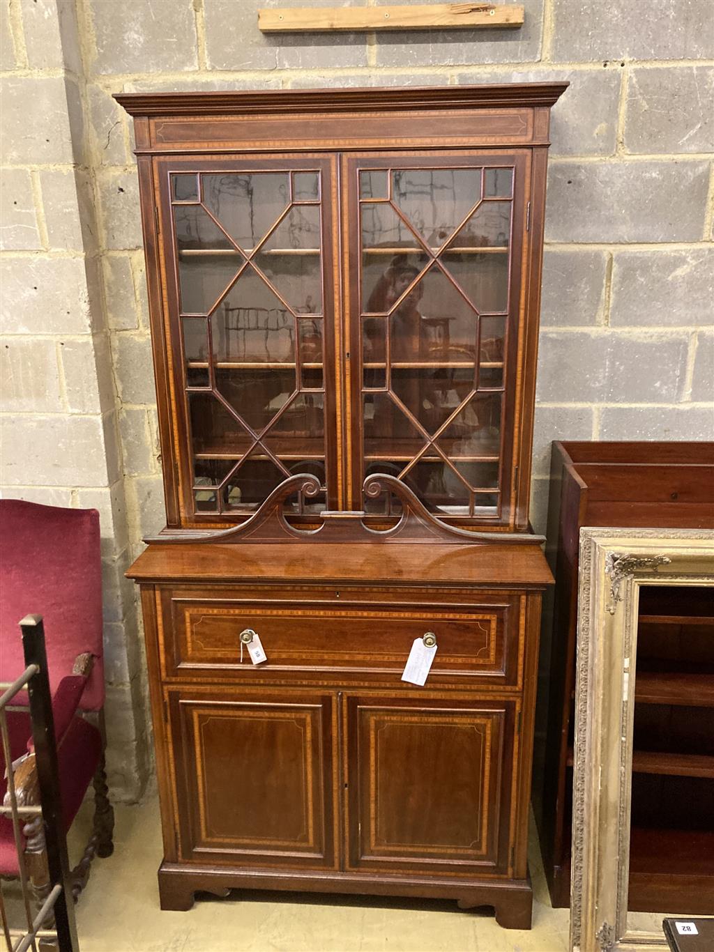 An Edwardian mahogany W&G (?) inlaid secretaire bookcase, width 107cm, depth 54cm, height 240cm